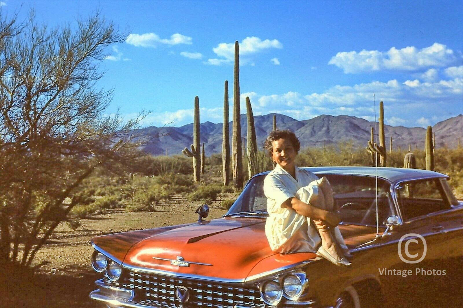 1960 Classic Car with Woman on Hood